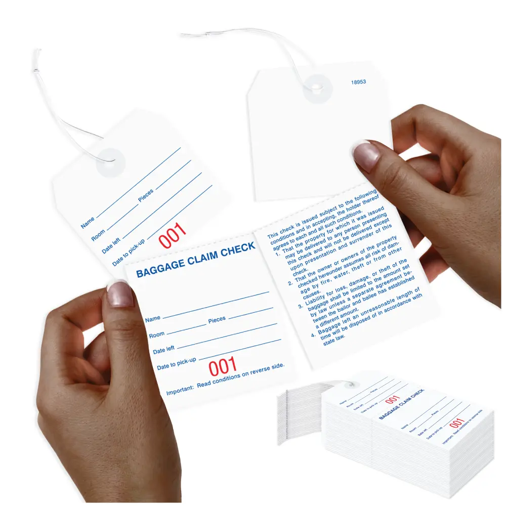 Baggage claim check tags with knotted string attached to tag AMS